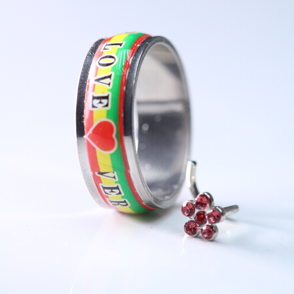 Set Of Two Items - One Love Ring And A Red Granate Corkscrew Piercing New